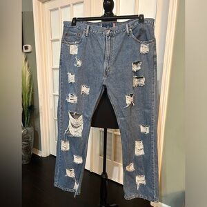 Distressed Levi jeans (men) meant to sit on the waist loosely. Sexy No stretch!